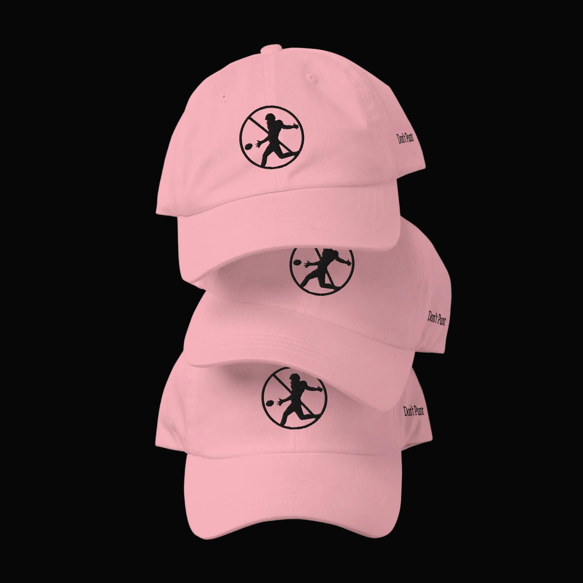 Stack of Don't Punt poker dad hats in pink - funny Texas Hold'em cap collection